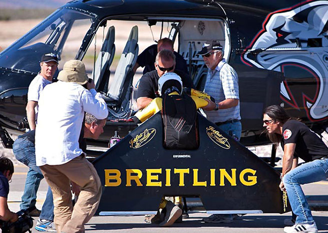 Breitling wing suit pilot boarding helicopter